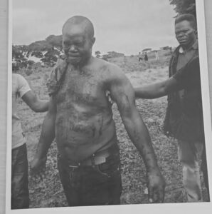 Namara, stained with blood, after he was rescued.