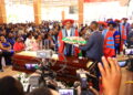 UCU VC lay a wreath on Pamela’s casket during the funeral mass at Uganda Christian University.