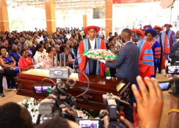 UCU VC lay a wreath on Pamela’s casket during the funeral mass at Uganda Christian University.