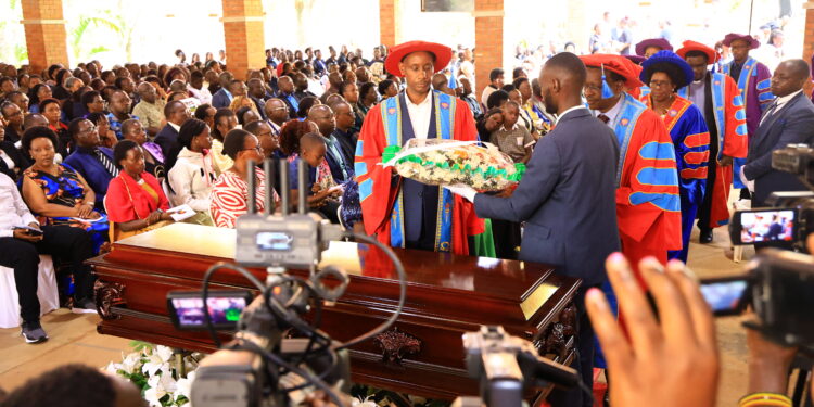 UCU VC lay a wreath on Pamela’s casket during the funeral mass at Uganda Christian University.