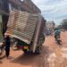 A vendor transports his dismantled kiosk on a tuktuk after municipal authorities marked roadside stalls for removal ahead of the planned enforcement.