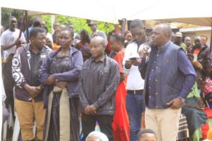 Ambassador Nsambu speaking to mourners during burial of his brother. 