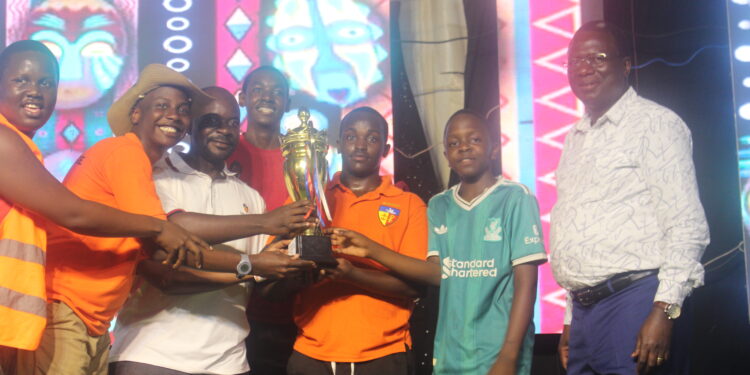 Mr Constatine Mpuuga with members of Mckee house who won the competition