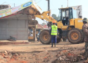 Authorities carry out an early morning demolition of roadside kiosks in Kikooza, Mukono Municipality, as part of an enforcement operation to clear illegal structures from road reserves.