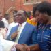 Bishop Jjumba greeting Mpuuga and Juliet Kakande after the Easter Mass