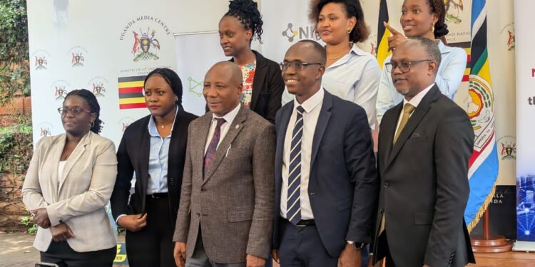 Officials from the National Information Technology Authority-Uganda and the Ministry of ICT, led by Godfrey Baluku Kabbyanga, pose for a group photo after unveiling the National IP Peering Exchange (NIPX) at the Uganda Media Centre.