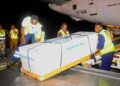 Family members receive the body of Timothy Muganzi Magambo, son of CID Director Tom Magambo, upon arrival at Entebbe International Airport.