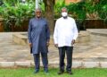 President Yoweri Museveni poses for a photo with Nigerian businessman Aliko Dangote after discussions on the proposed East African regional refinery at Nakasero.
