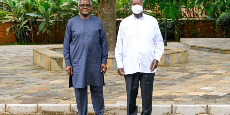 President Yoweri Museveni poses for a photo with Nigerian businessman Aliko Dangote after discussions on the proposed East African regional refinery at Nakasero.