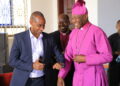 Archbishop Stephen Kaziimba Mugalu and Aaron Mushengyezi during discussions on Martyrs Day preparations at Namugongo.