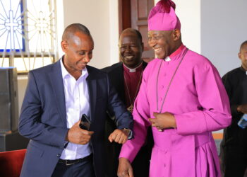 Archbishop Stephen Kaziimba Mugalu and Aaron Mushengyezi during discussions on Martyrs Day preparations at Namugongo.