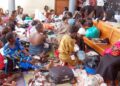 Mothers sit in a maternity ward at a health facility, awaiting care and reflecting ongoing demand for maternal health services.
