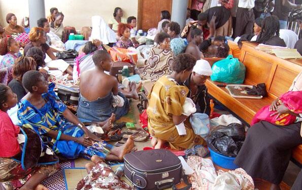 Mothers sit in a maternity ward at a health facility, awaiting care and reflecting ongoing demand for maternal health services.