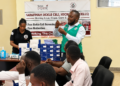 Joel Mugwanya, Field Officer at Sarafina Sickle Cell Clinic, speaking during the training on strengthening sickle cell care services at Kawolo Hospital in Buikwe District.
