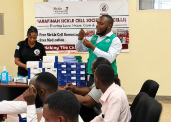 Joel Mugwanya, Field Officer at Sarafina Sickle Cell Clinic, speaking during the training on strengthening sickle cell care services at Kawolo Hospital in Buikwe District.