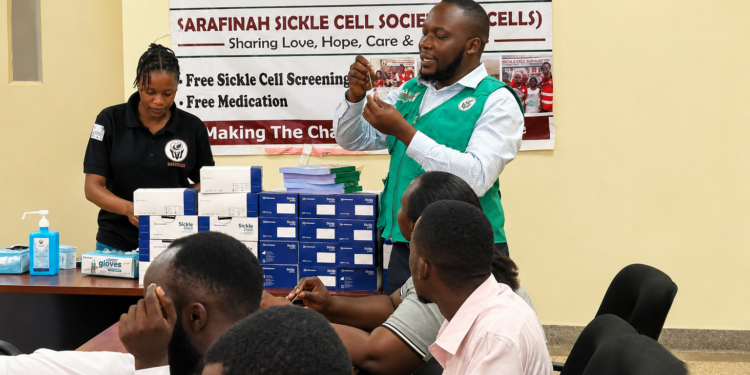 Joel Mugwanya, Field Officer at Sarafina Sickle Cell Clinic, speaking during the training on strengthening sickle cell care services at Kawolo Hospital in Buikwe District.