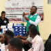 Joel Mugwanya, Field Officer at Sarafina Sickle Cell Clinic, speaking during the training on strengthening sickle cell care services at Kawolo Hospital in Buikwe District.