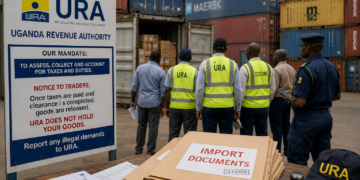 URA officials and customs officers inspecting containers at a busy port as importers’ documents lie ready for clearance, highlighting the official cargo verification process amid growing concerns over illegal charges in the logistics chain.