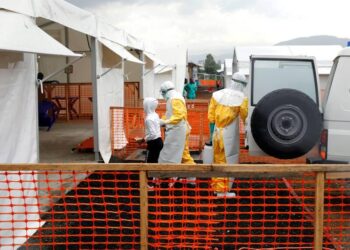 Security and health officials monitoring movement.