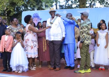 Outgoing leaders and District officials formally hand over Rotary insignia to Rtd. ACGP David Sekabembe Nsalasatta as he is installed as the 6th President of the Rotary Club of Sonde during a colorful Charter Night ceremony in Sonde.