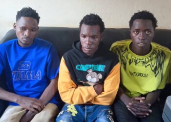 From left to right are Hassan Mugoya, Ashiraf Kyakatuka and Asuman Isanga detained at Iganga Central Police Station over alleged impersonation.