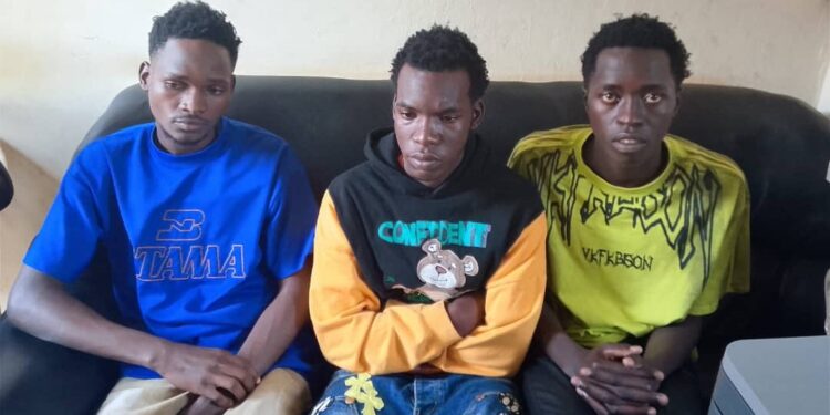 From left to right are Hassan Mugoya, Ashiraf Kyakatuka and Asuman Isanga detained at Iganga Central Police Station over alleged impersonation.