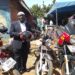 Goma Division Chairperson Hussein Ddumba Kato poses for a photo with one of the newly acquired motorcycles during the handover ceremony at the sacco offices in Mukono Municipality.
