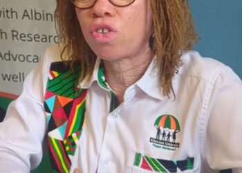 Olive Namutebi, Executive Director of Albinism Umbrella Uganda, addresses journalists during a press briefing in Kampala