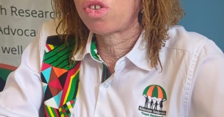 Olive Namutebi, Executive Director of Albinism Umbrella Uganda, addresses journalists during a press briefing in Kampala