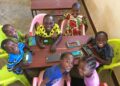 Learners using tablets during a classroom activity, part of the growing integration of digital learning tools in early childhood education.