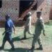 Police officers at Kitonzi Demonstration Nursery and Primary School during an operation targeting unlicensed schools.