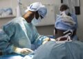Medical specialists conduct a complex life-saving operation