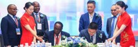 Prof. John Ddumba Ssentamu – Executive Chairman, Centenary Group and Paul Houpeiyong – Account Director Huawei Uganda sign the MOU as other Executive Members of both Centenary Group and Huawei look on..jp