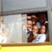 Children boarding a school bus during the morning commute.