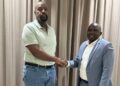 Patriotic League of Uganda (PLU) Chairman Muhoozi Kainerugaba shakes hands with newly appointed Secretary General Fadil Twallah