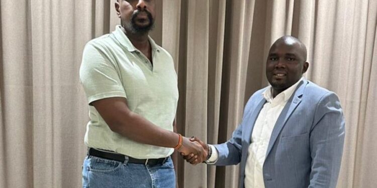 Patriotic League of Uganda (PLU) Chairman Muhoozi Kainerugaba shakes hands with newly appointed Secretary General Fadil Twallah