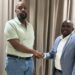 Patriotic League of Uganda (PLU) Chairman Muhoozi Kainerugaba shakes hands with newly appointed Secretary General Fadil Twallah
