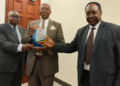 Left to right: Constitutional Court/Court of Appeal Justices Geoffrey Kiryabwire and Eldad Mwangusya Egonda-Ntende, together with Supreme Court Justice Christopher Izama Madrama, pose for a photograph during the presentation of an appreciation award.
