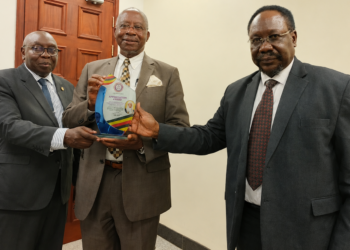Left to right: Constitutional Court/Court of Appeal Justices Geoffrey Kiryabwire and Eldad Mwangusya Egonda-Ntende, together with Supreme Court Justice Christopher Izama Madrama, pose for a photograph during the presentation of an appreciation award.