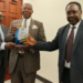 Left to right: Constitutional Court/Court of Appeal Justices Geoffrey Kiryabwire and Eldad Mwangusya Egonda-Ntende, together with Supreme Court Justice Christopher Izama Madrama, pose for a photograph during the presentation of an appreciation award.