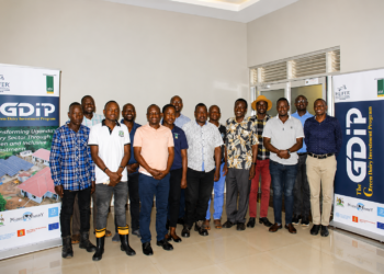 Agricultural extension workers and veterinary officers pose for a group photo during the launch of a dairy development programme in Masaka that will support 7,000 livestock farmers with modern farming practices.