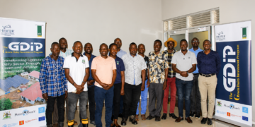 Agricultural extension workers and veterinary officers pose for a group photo during the launch of a dairy development programme in Masaka that will support 7,000 livestock farmers with modern farming practices.