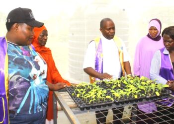 Members of the Lions Club of Masaka and Lions Club of Masaka Greater inspect community projects at Kyabumba Primary School in Masaka District ahead of their joint leadership handover ceremony.