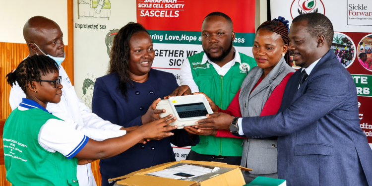 Officials from Goma Health Centre III and Mukono Municipality receive a Gazelle sickle cell diagnostic machine from Sarafinah Sickle Cell Society