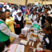 Minister of State for Health (General Duties), Anifa Kawooya Bangirana, inspects a sickle cell screening and testing station during the Self Care Awareness Day celebrations in Lugazi Municipality, Buikwe District