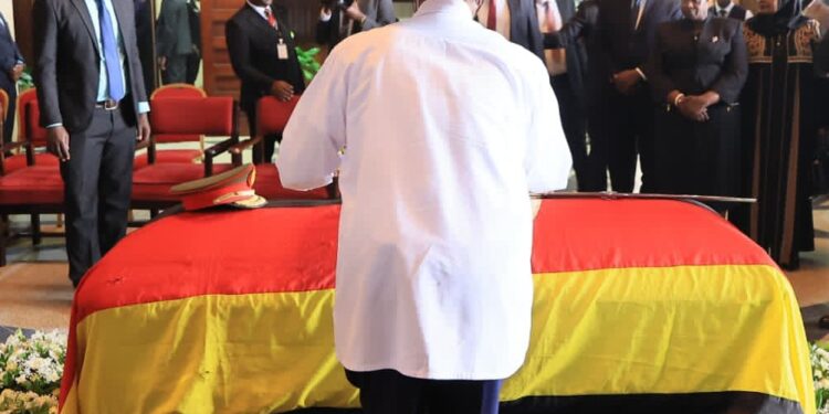 President Yoweri Kaguta Museveni pays his final respects to the late Gen. Moses Ali during a special parliamentary tribute.