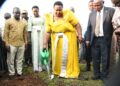 Minister for the Presidency, Hon. Milly Babirye Babalanda, plants a tree at Namagera Town Council Headquarters during the Jinja District Women's Day celebrations.