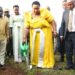 Minister for the Presidency, Hon. Milly Babirye Babalanda, plants a tree at Namagera Town Council Headquarters during the Jinja District Women's Day celebrations.