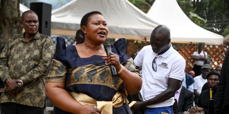 Minister for the Presidency Milly Babalanda addresses mourners during the burial of former Bank of Uganda Deputy Governor Perezi Tenywa Bukhumune