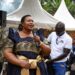 Minister for the Presidency Milly Babalanda addresses mourners during the burial of former Bank of Uganda Deputy Governor Perezi Tenywa Bukhumune